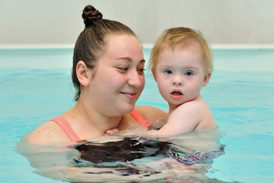 Mother and child swimming
